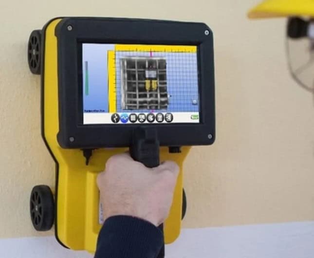 IDS C-thrue Concrete Scanner being used on a wall